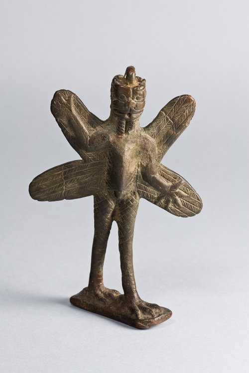 Iraq ca. 800-600 B.C. Bronze Purchased in New York, 1943 Oriental Institute Museum A25413 The demon Pazuzu stands but has a scorpion's body, feathered wings, avian legs, talons, and a lion face front and back.  Pazuzu, the "king of the evil wind demons," was not unfriendly. As an enemy of the Lamashtu demon, Pazuzu is portrayed on amulets for childbirth.  The ring at the top of this figurine suggests that it was such an amulet. https://oi.uchicago.edu/collections/highlights/highlights-collection-mesopotamia